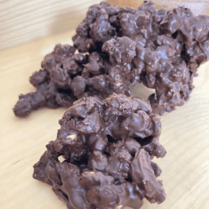 chocolate walnut raisin clusters on a wooden serving dish