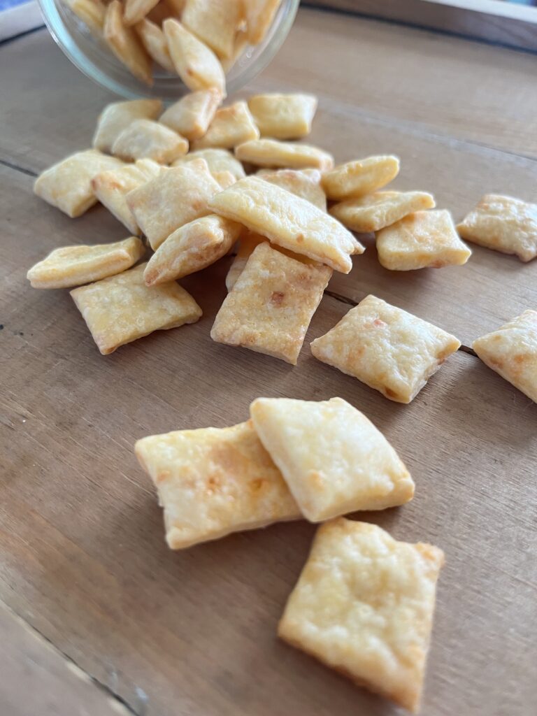 cheese crackers on a board