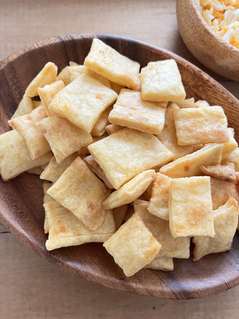 homemade cheese cracker in a wooden bowl