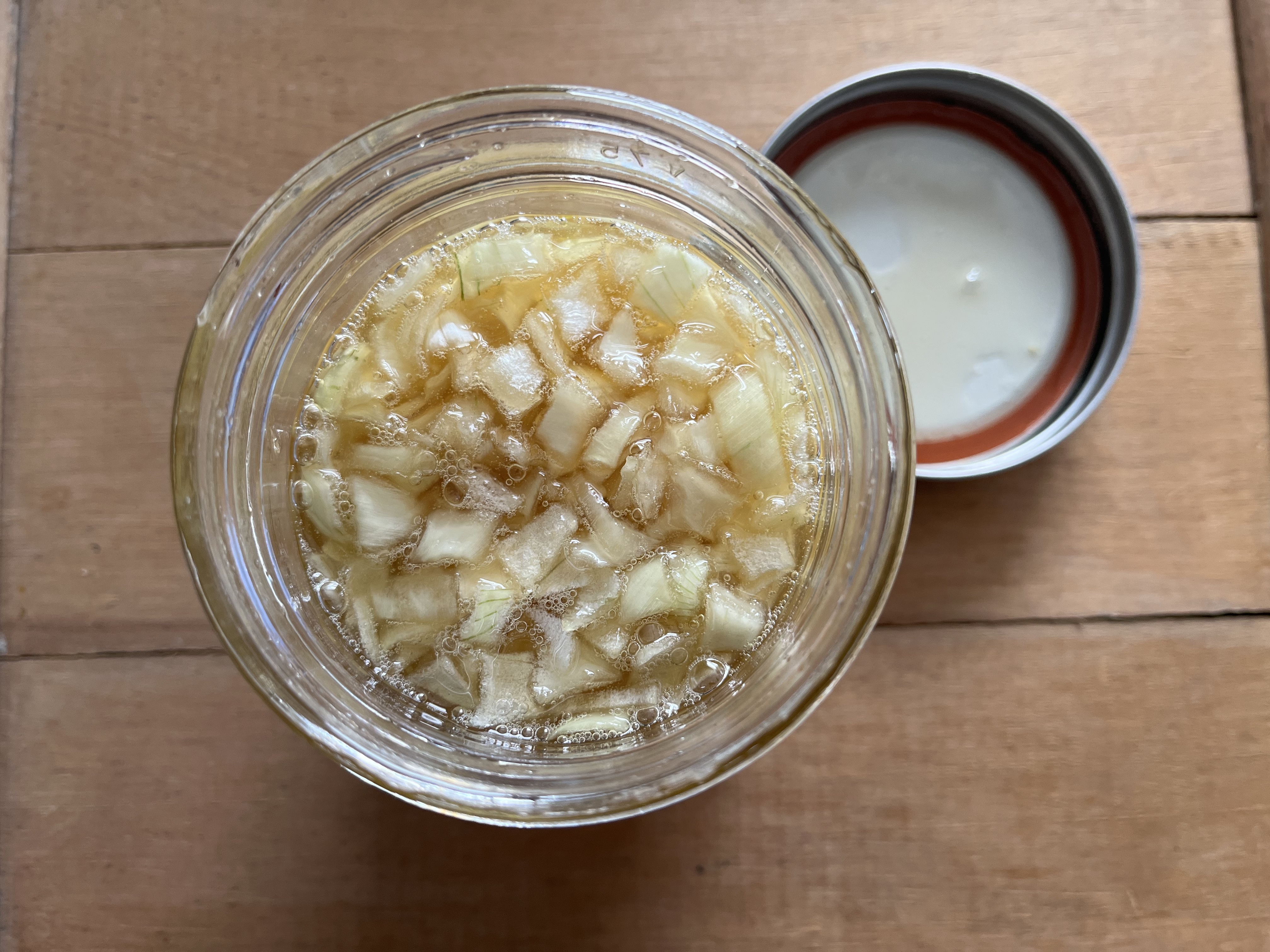 onions and honey in a jar